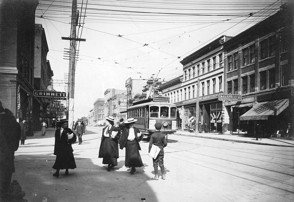 1907: A boy is selling newspapers on Granville and Robson. (Vancouver Archives)
