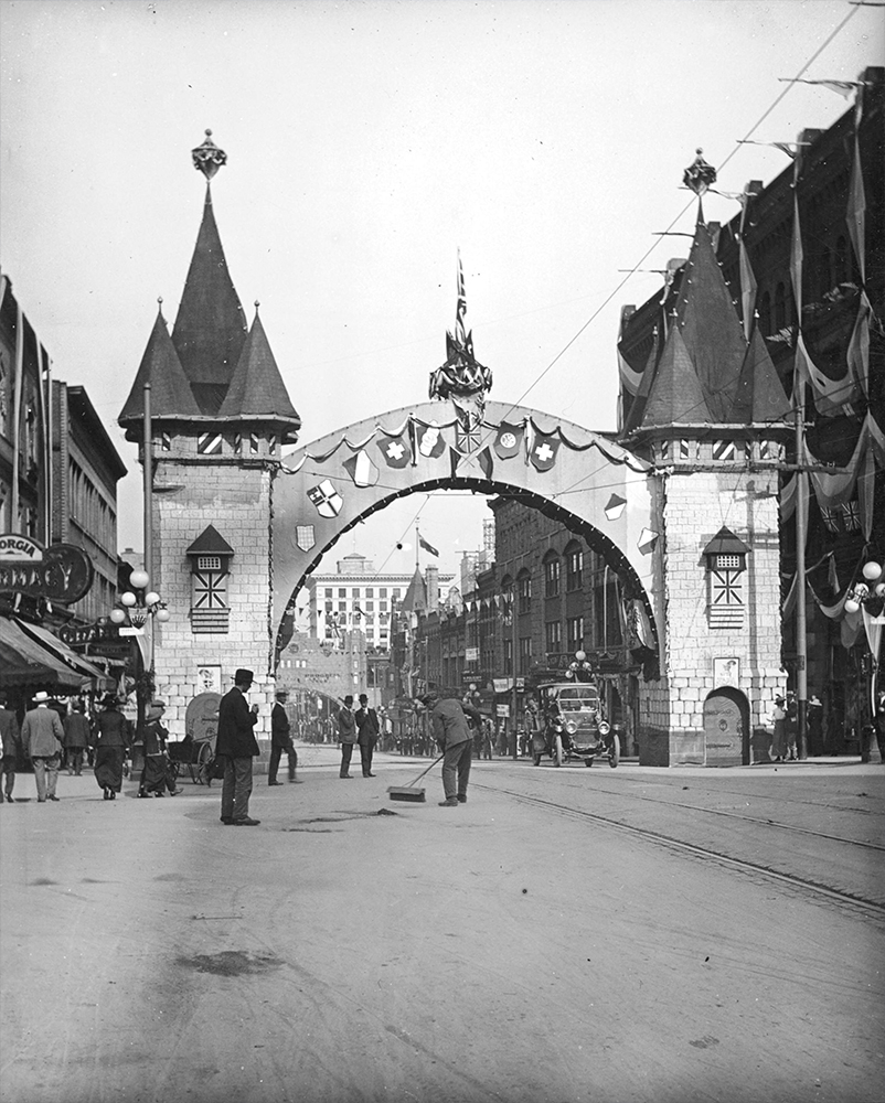 1912: A Model T can be seen if you zoom in on the right side of the arch erected by the German community to mark the visit of the Duke and Duchess of Connaught. (Vancouver Archives)