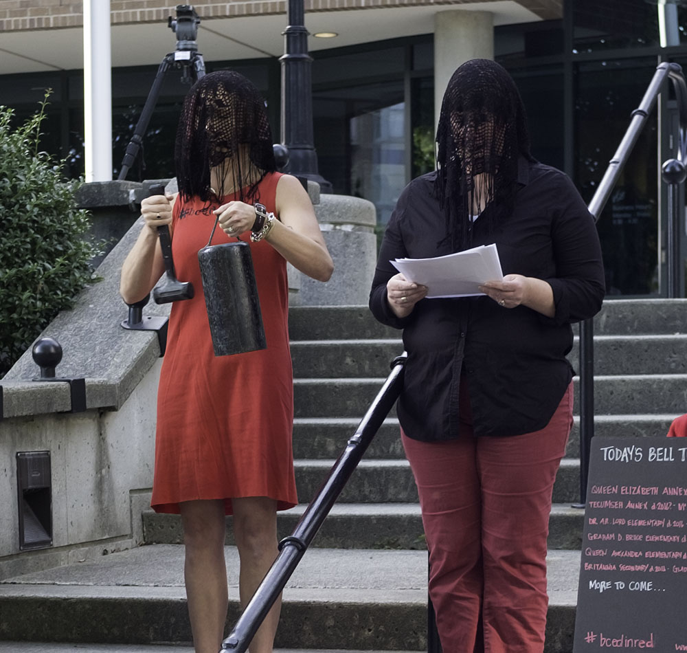 PAN co-founder Andrea Sinclair (right) read aloud the names of BC schools that have closed or are slated to close (Jenni Sheppard)