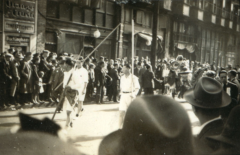 1937: A crowd has gathered for a funeral procession down Shanghai Alley. (Vancouver Archives)