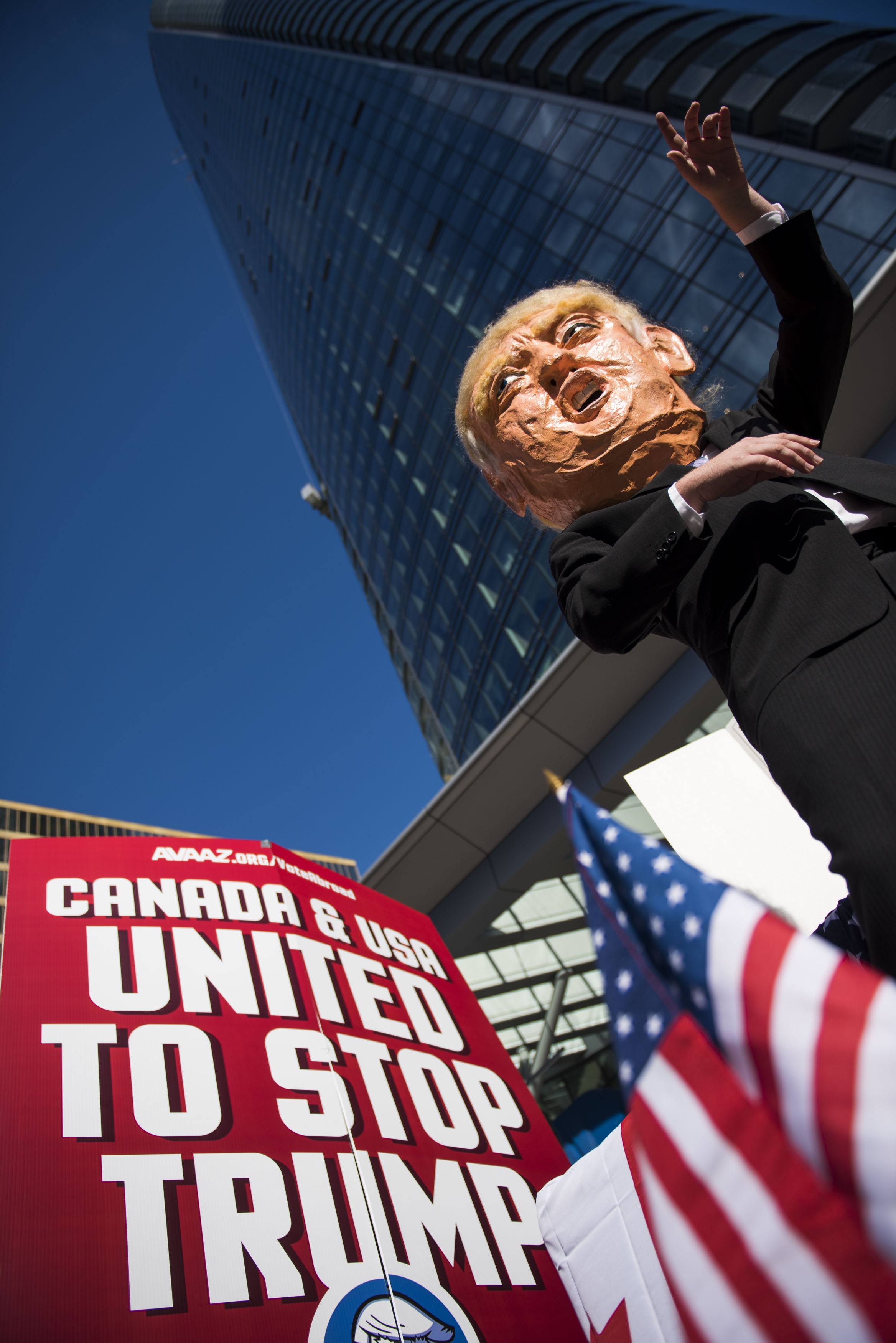 A flat bed “Stop Trump” truck sits outside the new Trump Tower in downtown Vancouver organized by Avaaz to launch a major new campaign to mobilise American expats across Canada to register and vote, in Vancouver, B.C. on Wednesday, October 5, 2016. (THE CANADIAN PRESS IMAGES/Jimmy Jeong)