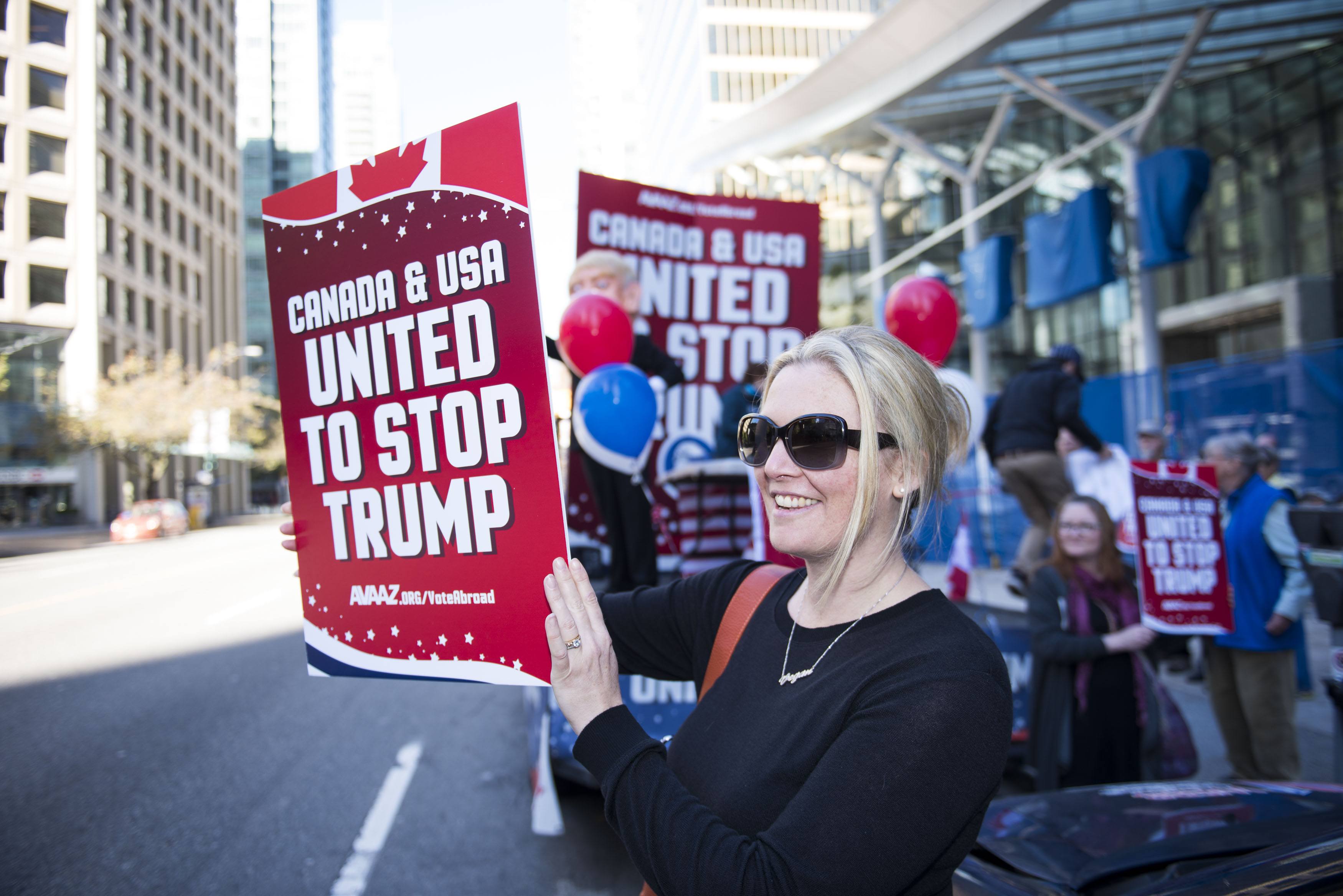 A flat bed “Stop Trump” truck sits outside the new Trump Tower in downtown Vancouver organized by Avaaz to launch a major new campaign to mobilise American expats across Canada to register and vote, in Vancouver, B.C. on Wednesday, October 5, 2016. (THE CANADIAN PRESS IMAGES/Jimmy Jeong)