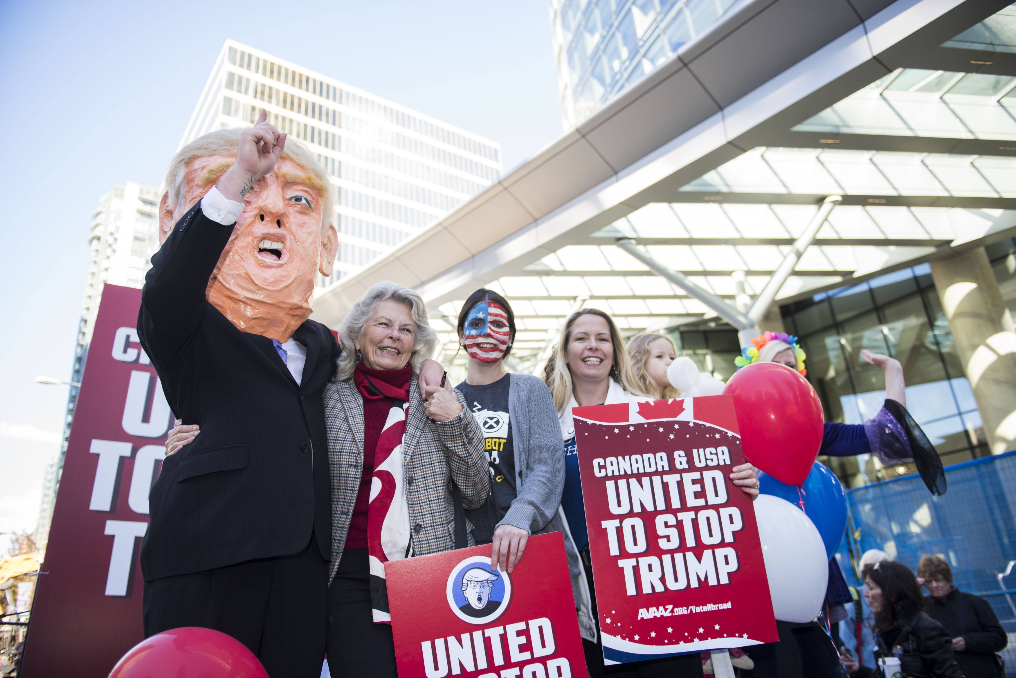 A flat bed “Stop Trump” truck sits outside the new Trump Tower in downtown Vancouver organized by Avaaz to launch a major new campaign to mobilise American expats across Canada to register and vote, in Vancouver, B.C. on Wednesday, October 5, 2016. (THE CANADIAN PRESS IMAGES/Jimmy Jeong)