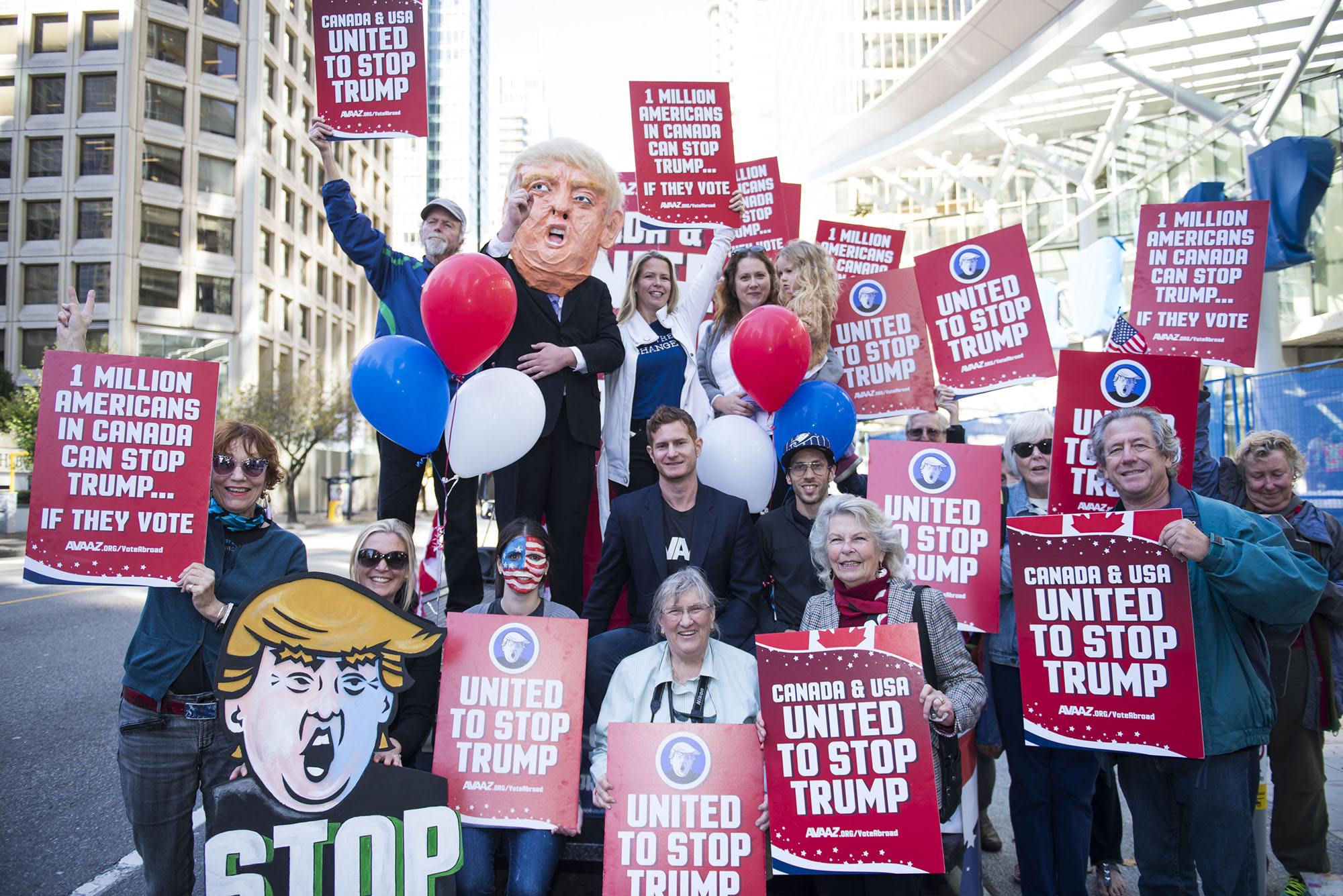 A flat bed “Stop Trump” truck sits outside the new Trump Tower in downtown Vancouver organized by Avaaz to launch a major new campaign to mobilise American expats across Canada to register and vote, in Vancouver, B.C. on Wednesday, October 5, 2016. (THE CANADIAN PRESS IMAGES/Jimmy Jeong)