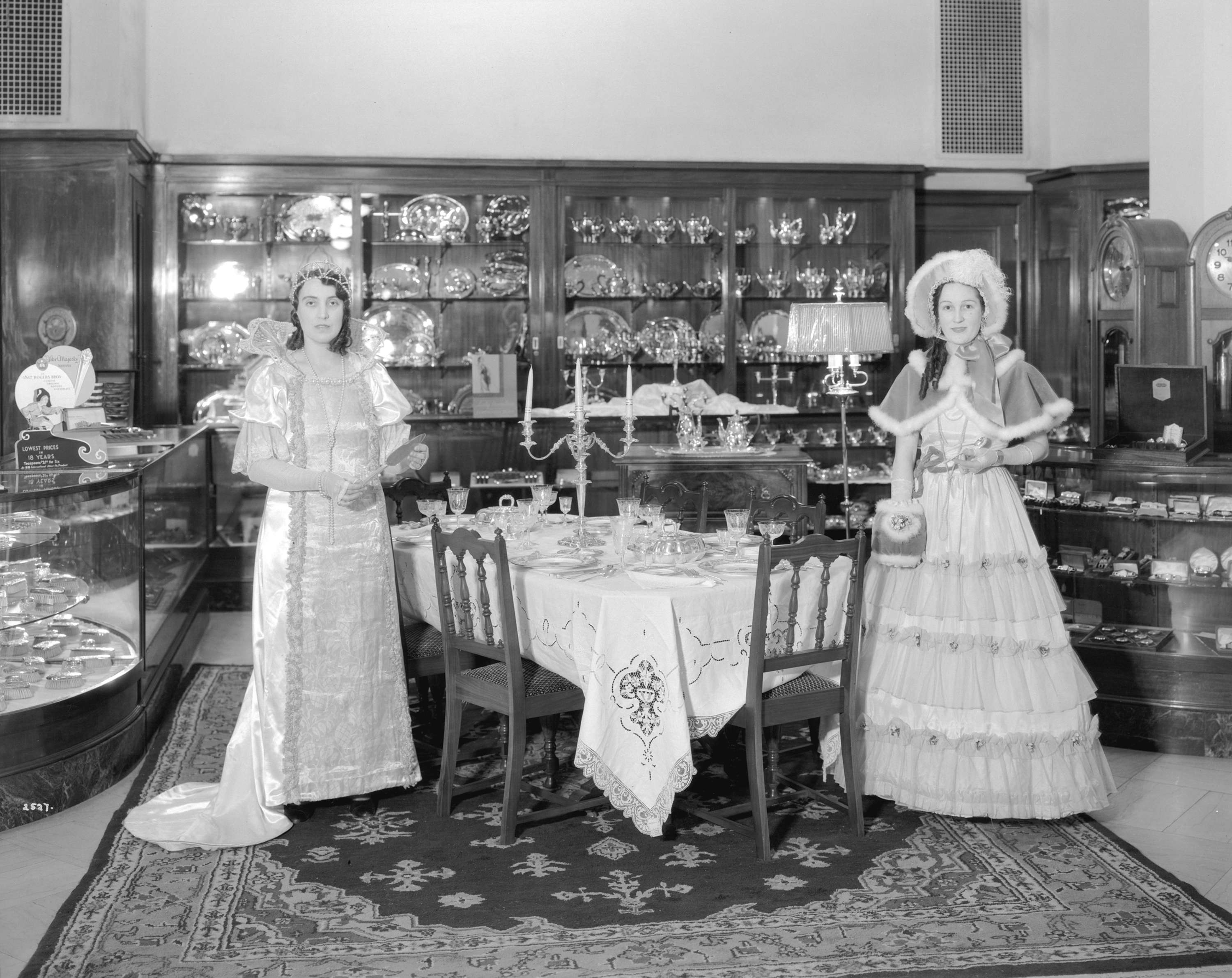 Models in period costumes display 'Community Plate' in the china and silverware department at Hudson's Bay in 1932 (Stuart Thomson/HBC)