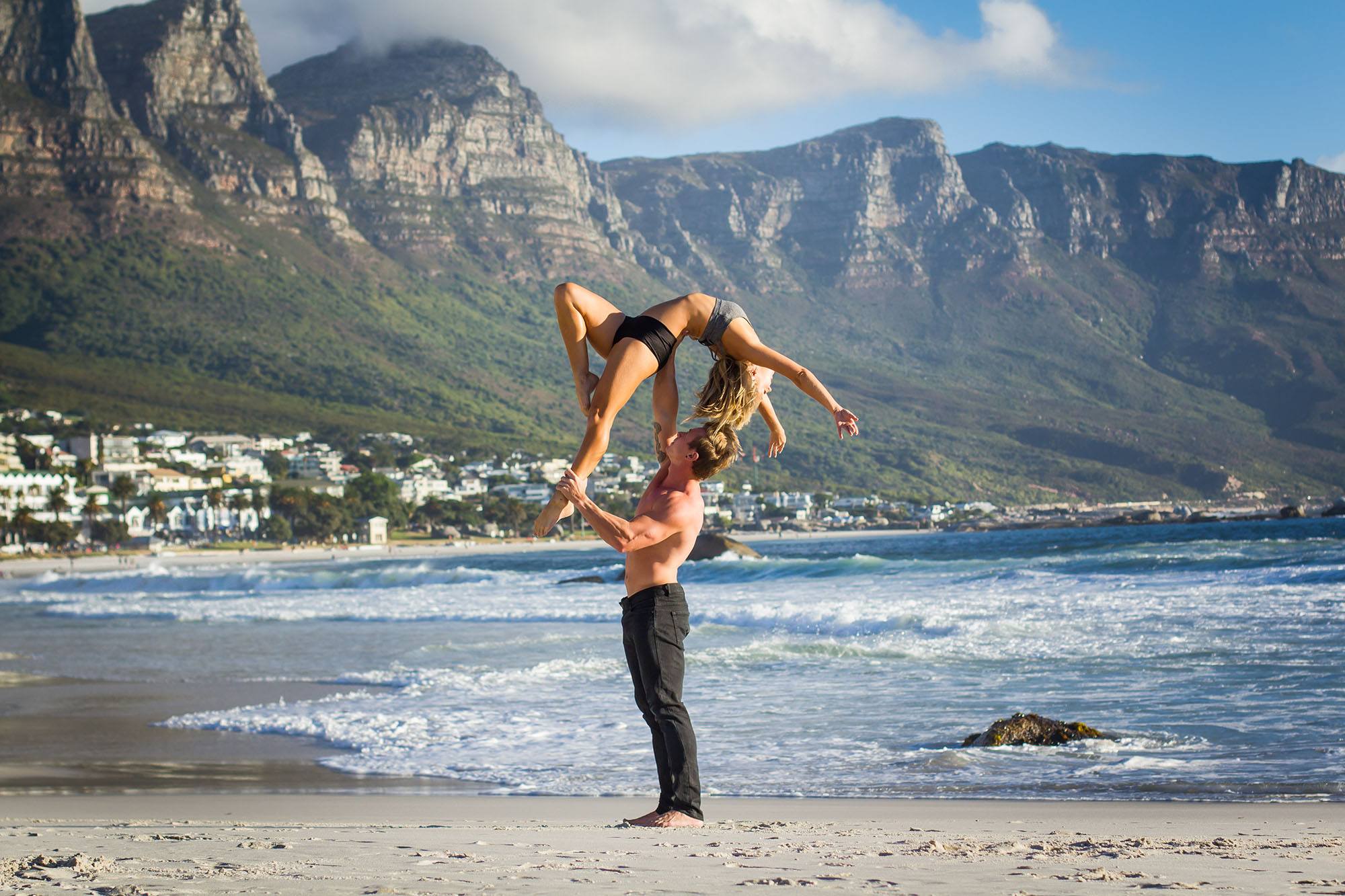 Nicole and James soaring on Glen beach, Cape Town (Amanda Webb)