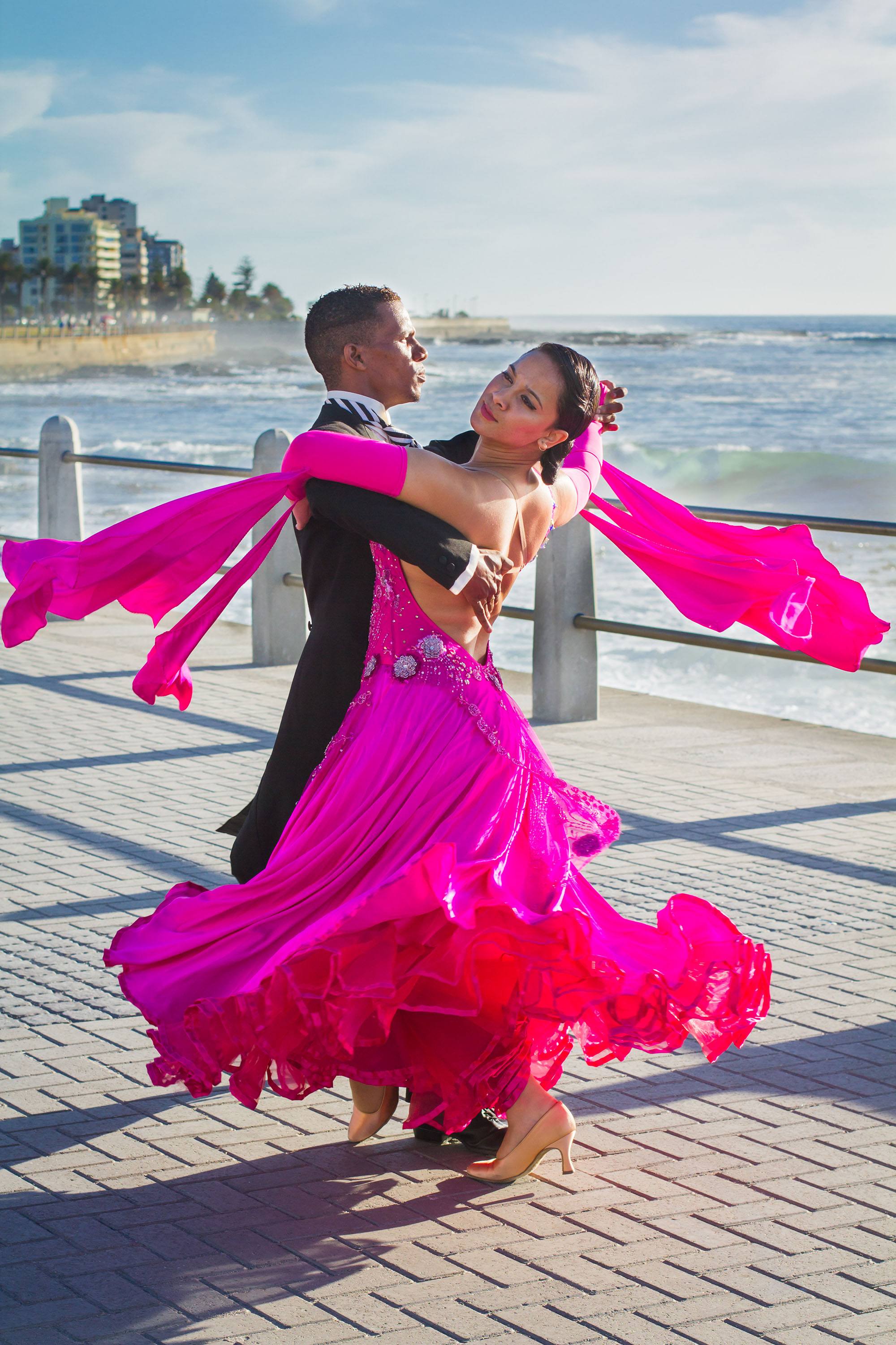 Dedicated elegance. Percephone and Angelo ballroom dance along the promenade in Cape Town. (Amanda Webb)