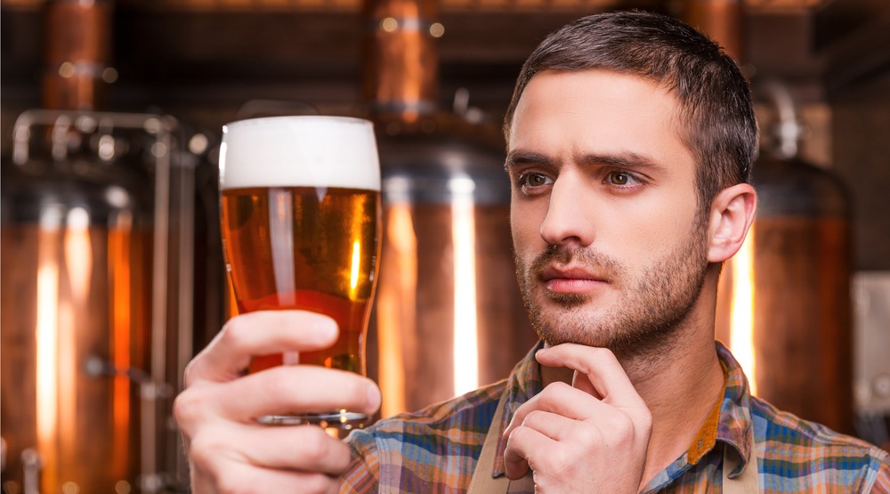 A man and his beer (g-stockstudio/Shutterstock)