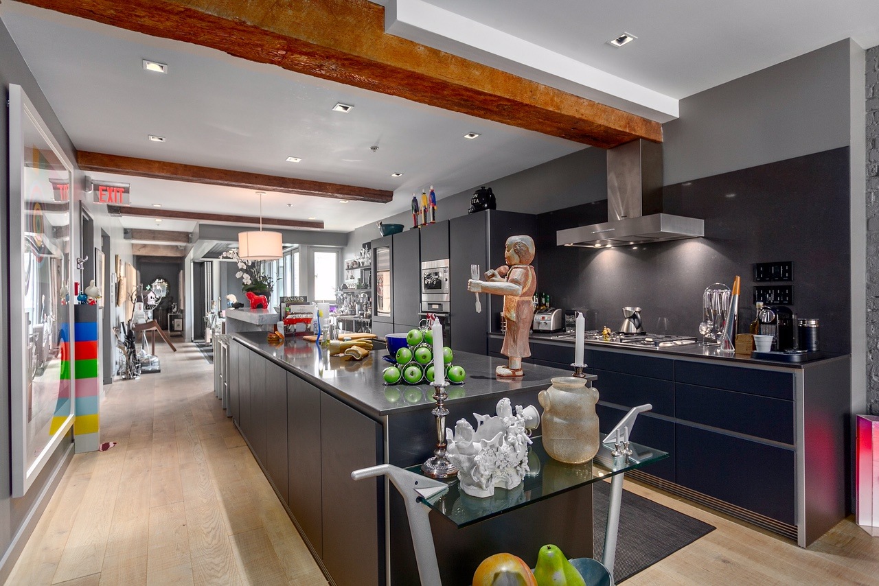 A large island sits in the middle of the kitchen (Angell Hasman & Associates (Eric Christiansen) Realty Ltd)