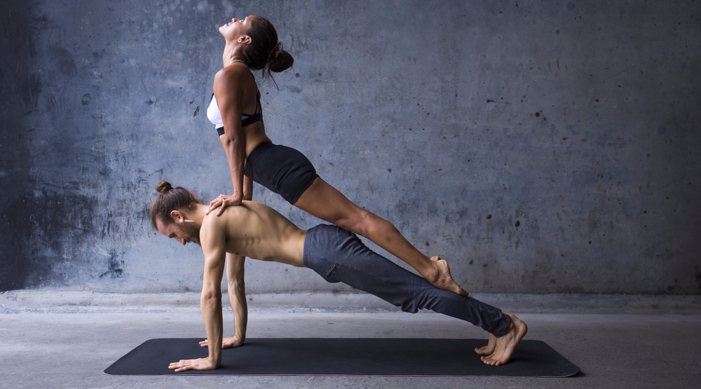 Couple practicing yoga 