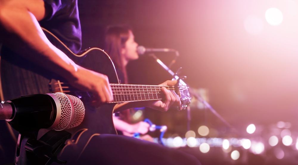 Guitarist on stage for background, soft and blur concept