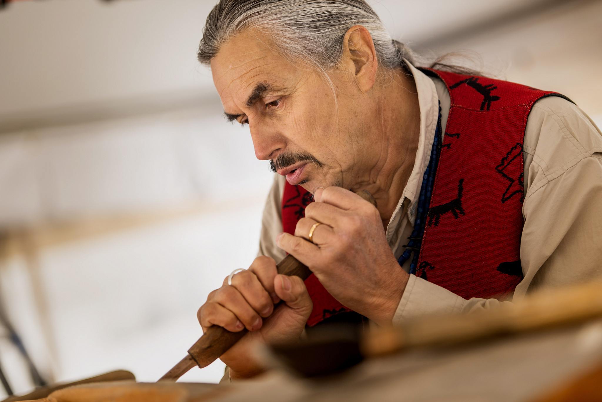 James Hart, Haida master carver and hereditary chief, carving the Reconciliation Pole (Paul Joseph/UBC)