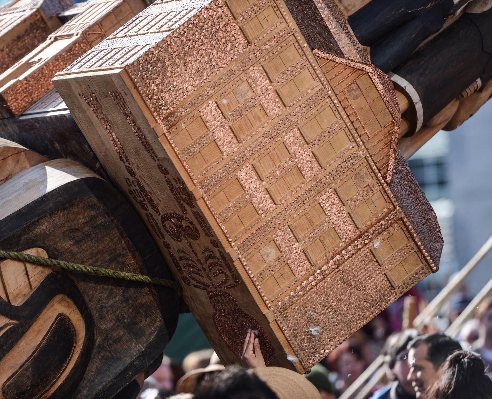 A depiction of the residential school system, with copper nails to represent the chidren who died there, on the new Reconciliation Pole at UBC (Paul Joseph/UBC)