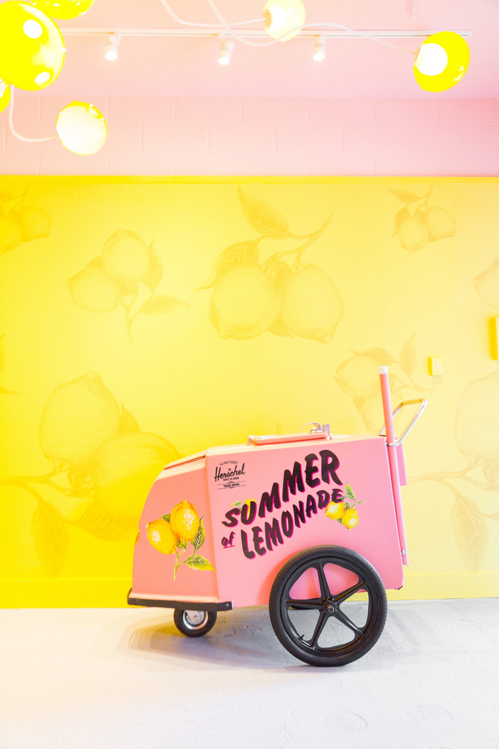 The theme hints on leisurely summer days & childhood lemonade stands. (Herschel Co.)