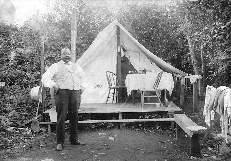 Joe Fortes in front of his tent at English Bay in the 1890s. Later the City would give him a cottage on English Bay. City of Vancouver Archives #Port P1725.