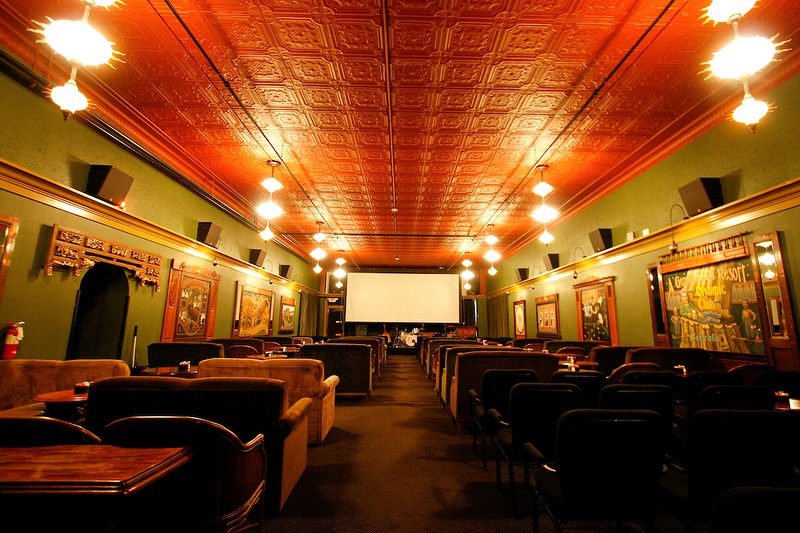 A McMenamins movie theatre decked out with tables and coaches (@mcmenamins / Instagram)