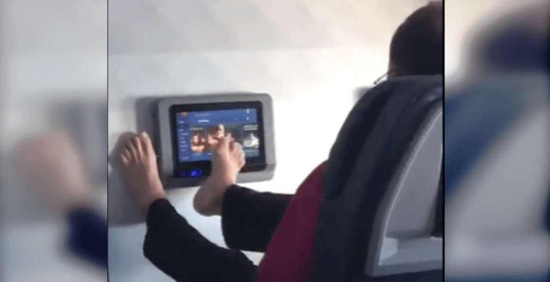 Viral video shows air passenger using feet to choose in-flight movie