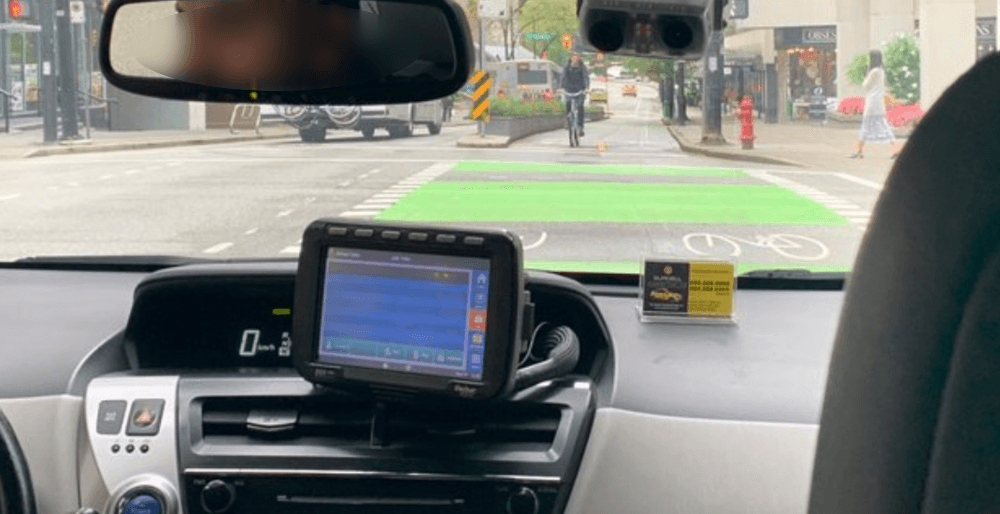 VPD investigate after cab caught driving in separated bike lane (VIDEO)