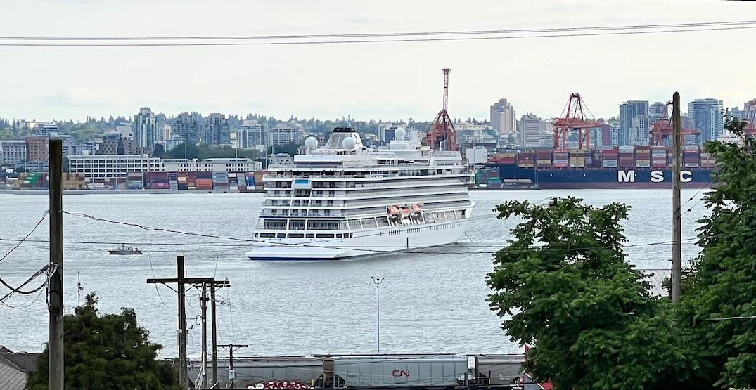 Cruise ship anchors in the middle of Burrard Inlet and ferries passengers to Vancouver
