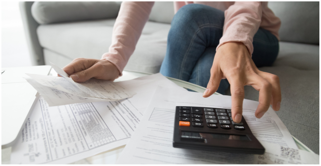 A photo of a woman paying bills