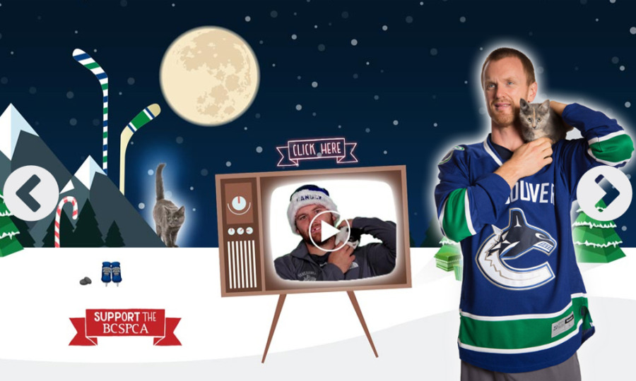 The Vancouver Canucks 2014 Christmas card features its most popular players cuddling cats. (Canucks)