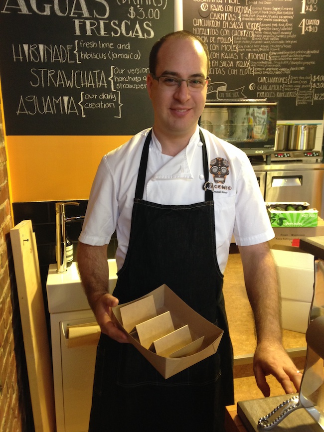 Fhernando Llanas, holding Tacomio's eco-friendly custom-designed taco take-out box (Lindsay William-Ross/Vancity Buzz)