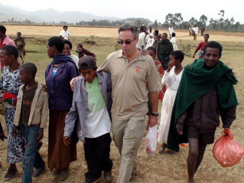 Gary and Tesfaye walking to village