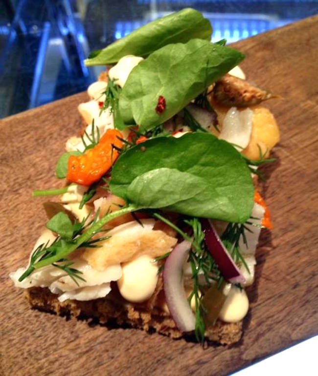 Smoked sablefish, caper berries, red onion, mustard aioli Toast at Bel Café (Photo via Bel Café/Facebook) 