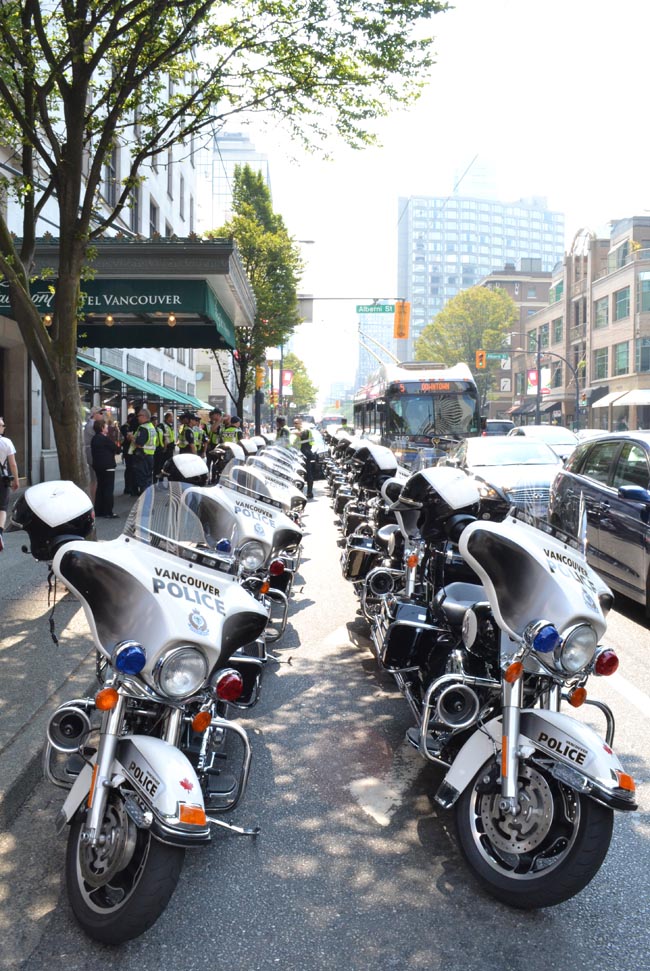 Police escort outside the Fairmont Hotel.